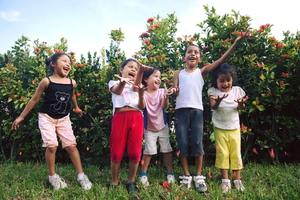 Girls throwing flowers in the air